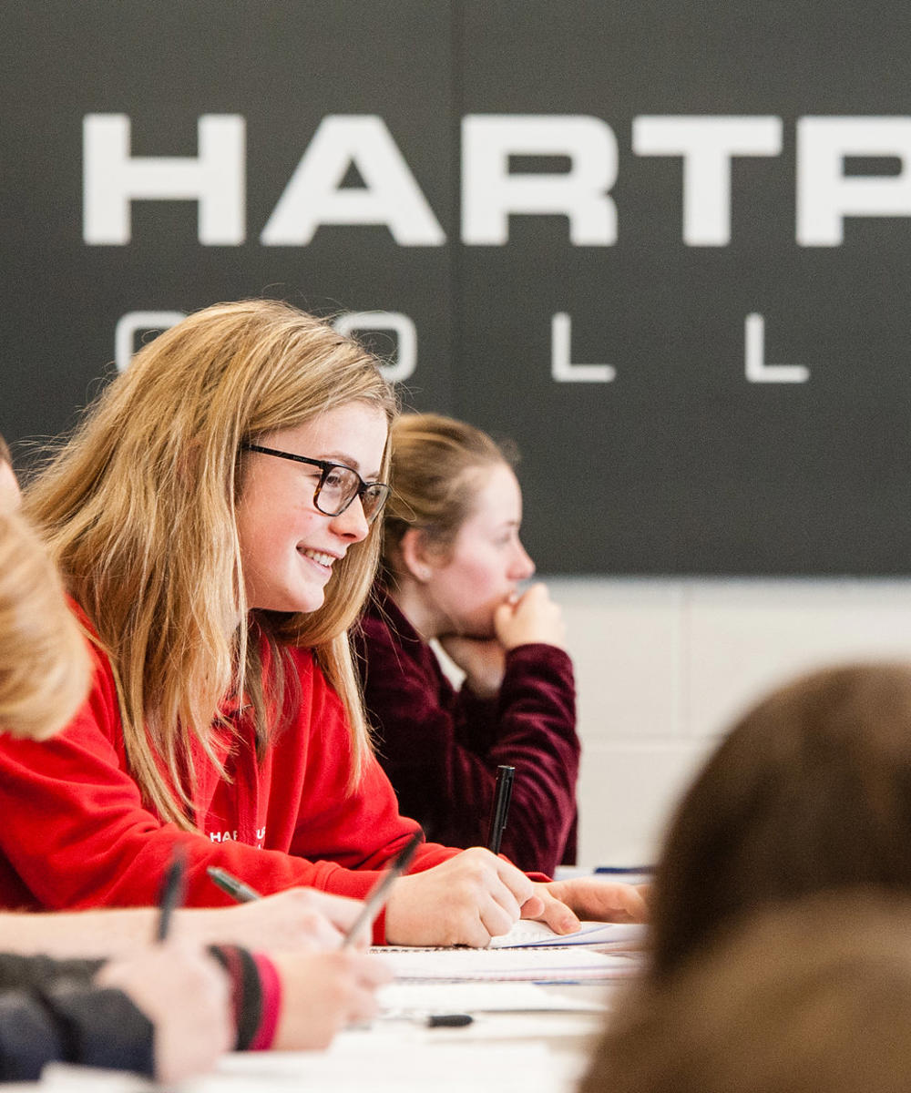 Image of a group of students sat in a lecture theatre