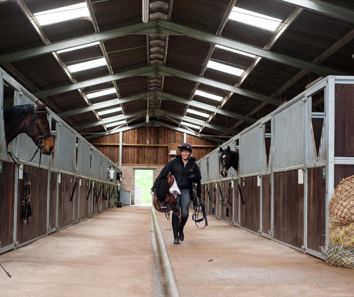 Student Walking Through Equine Yard