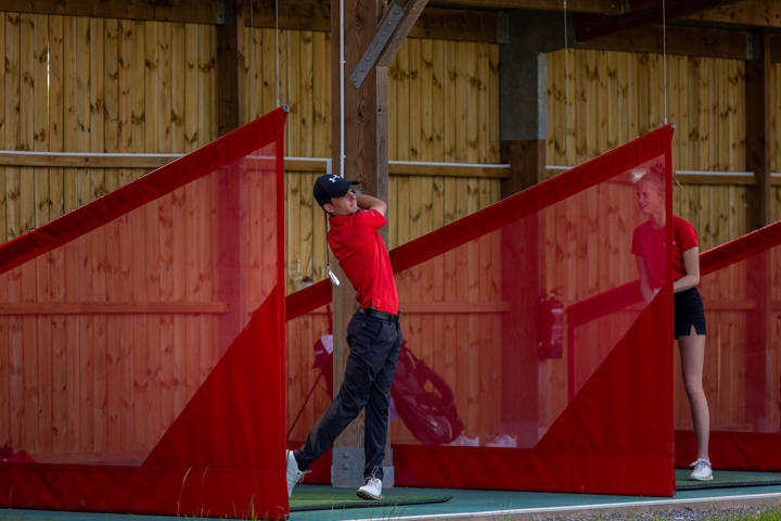 College Students On Driving Range